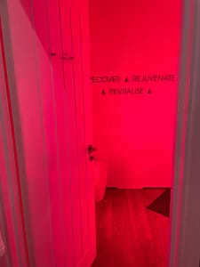 room lit up by Red Light therapy panel